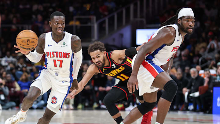 Feb 23, 2025; Atlanta, Georgia, USA; Detroit Pistons guard Dennis Schroder (17) and Detroit Pistons center Isaiah Stewart (28) run offensive screen against Atlanta Hawks guard Trae Young (11) during the first quarter at State Farm Arena. Mandatory Credit: Jordan Godfree-Imagn Images