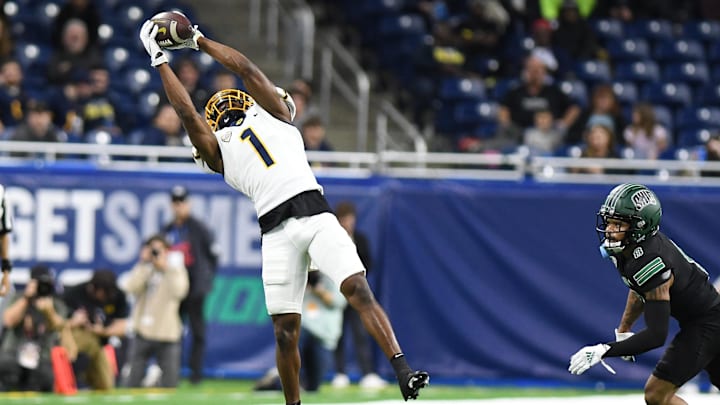 Dec 3, 2022; Detroit, Michigan, USA;  Toledo  wide receiver Jerjuan Newton (1) makes a leaping catch for a first down against Ohio University in the second quarter at Ford Field. Mandatory Credit: Lon Horwedel-Imagn Images