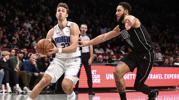 Nov 29, 2024; Brooklyn, New York, USA;  Orlando Magic forward Franz Wagner (22) drives past Brooklyn Nets guard Ben Simmons (10) in the fourth quarter at Barclays Center. Mandatory Credit: Wendell Cruz-Imagn Images