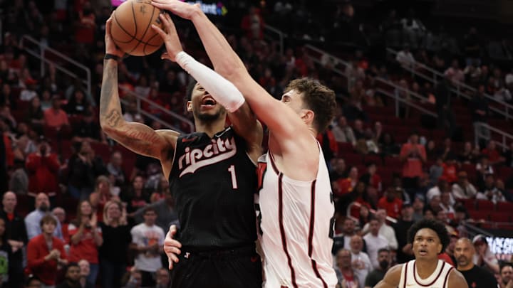 Nov 23, 2024; Houston, Texas, USA;Portland Trail Blazers guard Anfernee Simons (1) is fouled by Houston Rockets center Alperen Sengun (28) in the second half at Toyota Center. Mandatory Credit: Thomas Shea-Imagn Images