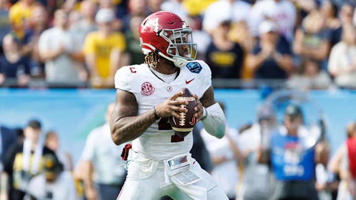 Dec 31, 2024; Tampa, FL, USA; Alabama Crimson Tide quarterback Jalen Milroe (4) looks to throw against the Michigan Wolverines during the second half at Raymond James Stadium. Mandatory Credit: Matt Pendleton-Imagn Images