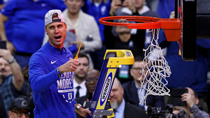 Scheyer cuts down the net after the Blue Devils won the East Regional to advance to the Final Four.