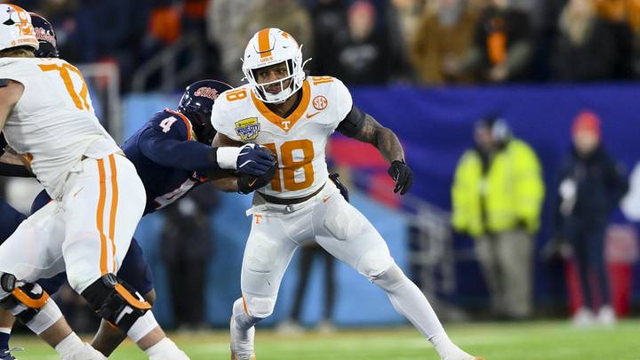 Dec 30, 2025; Nashville, TN, USA; Tennessee Volunteers running back Desean Bishop (18) runs with the ball against the Illinois Fighting Illini during the first half at Nissan Stadium. Mandatory Credit: Steve Roberts-Imagn Images