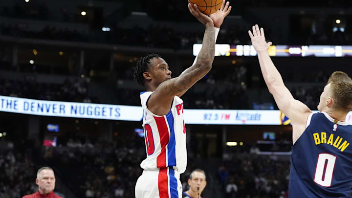 Dec 28, 2024; Denver, Colorado, USA; Detroit Pistons forward Ronald Holland II (00) shoots the ball over Denver Nuggets guard Christian Braun (0) in the second half at Ball Arena. Mandatory Credit: Ron Chenoy-Imagn Images