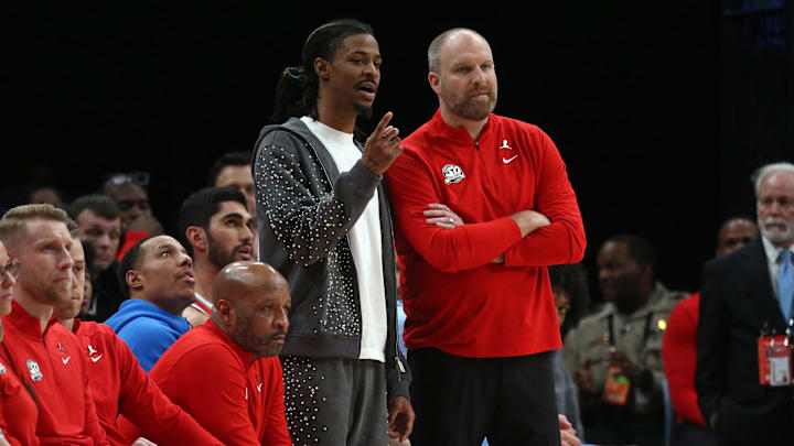 Mar 1, 2025; Memphis, Tennessee, USA; Memphis Grizzlies guard Ja Morant (left) talks with head coach Taylor Jenkins during the fourth quarter against the San Antonio Spurs at FedExForum. Mandatory Credit: Petre Thomas-Imagn Images