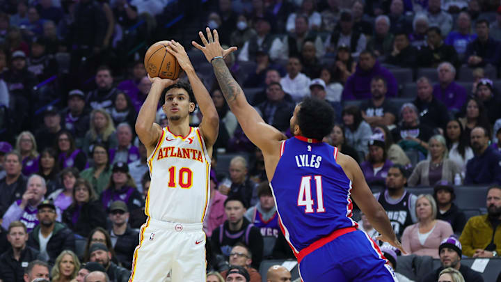 Nov 18, 2024; Sacramento, California, USA; Atlanta Hawks forward Zaccharie Risacher (10) shoots the ball against Sacramento Kings forward Trey Lyles (41) during the first quarter at Golden 1 Center. Mandatory Credit: Sergio Estrada-Imagn Images