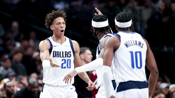 Feb 13, 2025; Dallas, Texas, USA; Dallas Mavericks forward Kessler Edwards (20) celebrates with teammates during the second half against the Miami Heat at American Airlines Center. Mandatory Credit: Kevin Jairaj-Imagn Images Feb 13, 2025; Dallas, Texas, USA; Dallas Mavericks forward Kessler Edwards (20) celebrates with teammates during the second half against the Miami Heat at American Airlines Center. Mandatory Credit: Kevin Jairaj-Imagn Images