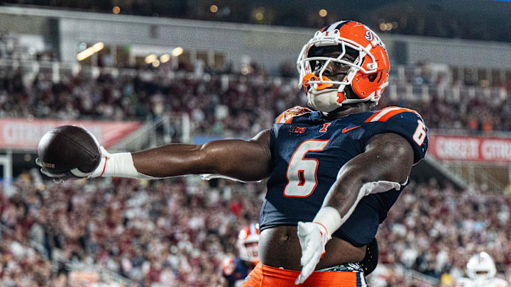 Dec 31, 2024; Orlando, FL, USA; Illinois Fighting Illini running back Josh McCray (6) celebrates his touchdown against the South Carolina Gamecocks in the fourth quarter at Camping World Stadium. Mandatory Credit: Jeremy Reper-Imagn Images Dec 31, 2024; Orlando, FL, USA; Illinois Fighting Illini running back Josh McCray (6) celebrates his touchdown against the South Carolina Gamecocks in the fourth quarter at Camping World Stadium. Mandatory Credit: Jeremy Reper-Imagn Images