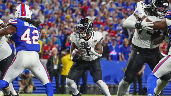 Sep 23, 2024; Orchard Park, New York, USA; Jacksonville Jaguars running back Travis Etienne Jr. (1) runs during the second half against the Buffalo Bills at Highmark Stadium. Mandatory Credit: Gregory Fisher-Imagn Images Sep 23, 2024; Orchard Park, New York, USA; Jacksonville Jaguars running back Travis Etienne Jr. (1) runs during the second half against the Buffalo Bills at Highmark Stadium. Mandatory Credit: Gregory Fisher-Imagn Images