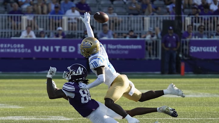 Sep 27, 2025; Evanston, Illinois, USA; UCLA Bruins defensive back Rodrick Pleasant (18) defends Northwestern Wildcats wide receiver Hayden Eligon II (80) during the second half at Northwestern Medicine Field at Martin Stadium. Mandatory Credit: David Banks-Imagn Images Sep 27, 2025; Evanston, Illinois, USA; UCLA Bruins defensive back Rodrick Pleasant (18) defends Northwestern Wildcats wide receiver Hayden Eligon II (80) during the second half at Northwestern Medicine Field at Martin Stadium. Mandatory Credit: David Banks-Imagn Images