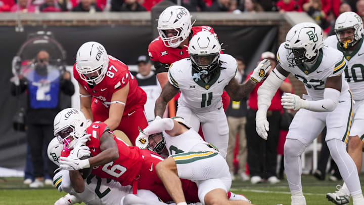 Oct 25, 2025; Cincinnati, Ohio, USA; Cincinnati Bearcats running back Evan Pryor (6) scores a touchdown against members of the Baylor Bears in the first half at Nippert Stadium. Mandatory Credit: Aaron Doster-Imagn Images Oct 25, 2025; Cincinnati, Ohio, USA; Cincinnati Bearcats running back Evan Pryor (6) scores a touchdown against members of the Baylor Bears in the first half at Nippert Stadium. Mandatory Credit: Aaron Doster-Imagn Images