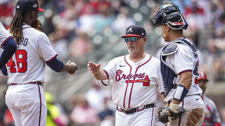 Apr 23, 2025; Cumberland, Georgia, USA; Atlanta Braves manager Brian Snitker (43) removes pitcher Rafael Montero (48) from the game against the St. Louis Cardinals during the eighth inning at Truist Park. Mandatory Credit: Dale Zanine-Imagn Images