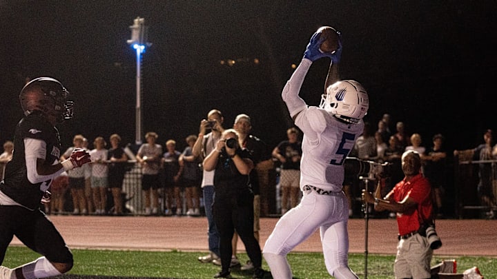 IMG's Winston Watkins Jr. (5) pulls in a touchdown just ahead of Lipscomb's Brooks McInteer (5) at