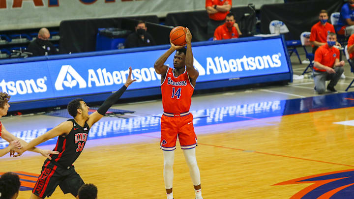 Feb 13, 2021; Boise, Idaho, USA; Boise State Broncos guard Emmanuel Akot (14) shoots against the