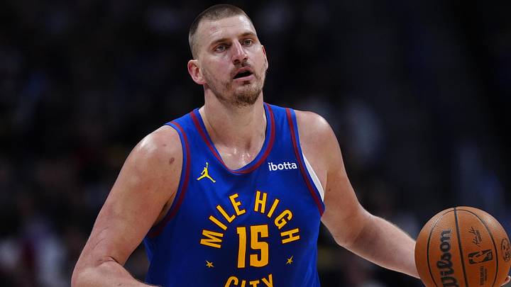 Mar 22, 2026; Denver, Colorado, USA; Denver Nuggets center Nikola Jokic (15) controls the ball in the first quarter against the Portland Trail Blazers at Ball Arena. Mandatory Credit: Ron Chenoy-Imagn Images