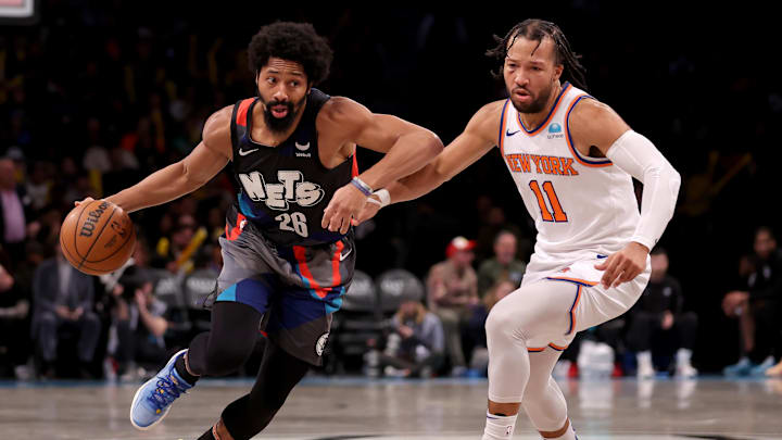 Dec 20, 2023; Brooklyn, New York, USA; Brooklyn Nets guard Spencer Dinwiddie (26) drives to the basket against New York Knicks guard Jalen Brunson (11) during the third quarter at Barclays Center. Mandatory Credit: Brad Penner-Imagn Images