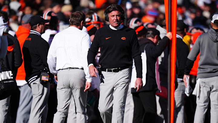Nov 29, 2024; Boulder, Colorado, USA; Oklahoma State Cowboys head coach Mike Gundy walks the sidelines in the second half against the Colorado Buffaloes at Folsom Field. Mandatory Credit: Ron Chenoy-Imagn Images