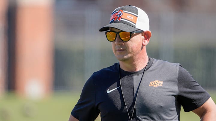 Head coach Eric Morris stands on the field during Oklahoma State football practice in Stillwater, Okla., on Tuesday, March 24, 2026.