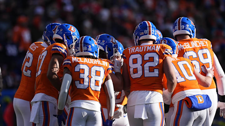 Jan 5, 2025; Denver, Colorado, USA; Members of the Denver Broncos offensive squad huddle in the first quarter against the Kansas City Chiefs at Empower Field at Mile High. Mandatory Credit: Ron Chenoy-Imagn Images