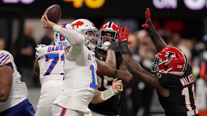 Buffalo Bills quarterback Josh Allen (17) is pressured by Atlanta Falcons defensive end Jalon Walker (11) during the first half of a game at Mercedes-Benz Stadium. Buffalo Bills quarterback Josh Allen (17) is pressured by Atlanta Falcons defensive end Jalon Walker (11) during the first half of a game at Mercedes-Benz Stadium.