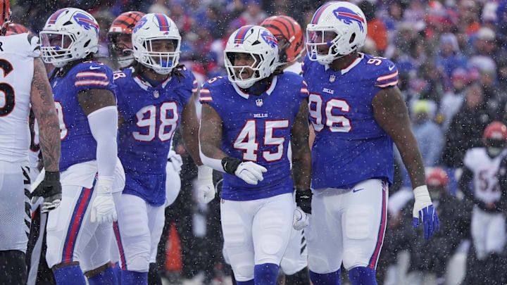 Buffalo Bills LB Shaq Thompson and DT Deone Walker react to a tackle during first-half action at Highmark Stadium.