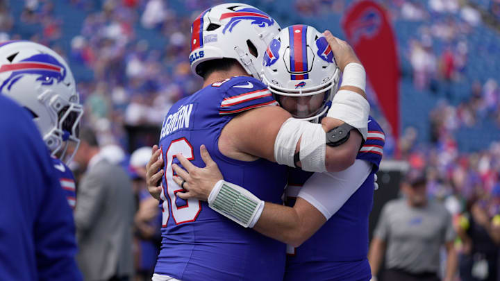 Buffalo Bills center Connor McGovern hugs quarterback Josh Allen as teammates greet each other during team warm up before the Bills home game against the New Orleans Saints in Orchard Park on Sept. 28, 2025.