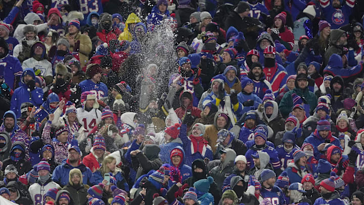 Some fans throw snow in the air to celebrate a Buffalo Bills touchdown against the Jets at Highmark Stadium in Orchard Park on Jan. 4, 2026.