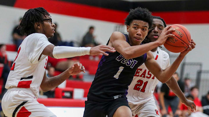 Green Bay West High School's KJ Howell (1) drives to the basket against Green Bay East High School on Tuesday, February 10, 2026, at Green Bay East High School in Green Bay, Wis. Green Bay East won the game, 62-42.
Tork Mason/USA TODAY NETWORK-Wisconsin
