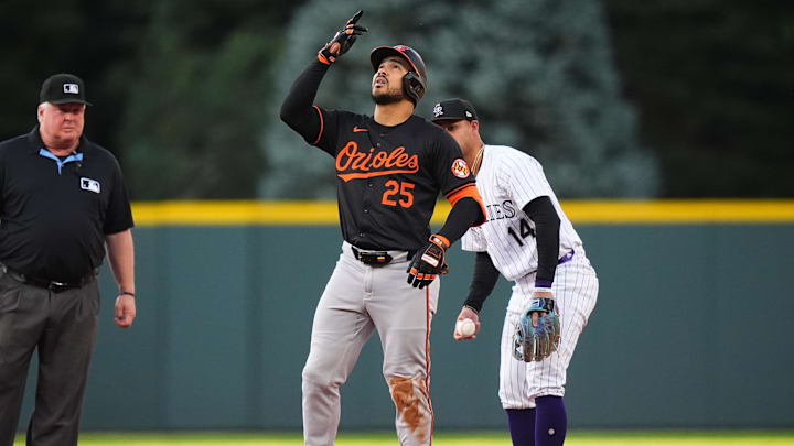 Aug 30, 2024; Denver, Colorado, USA; Baltimore Orioles outfielder Anthony Santander (25) celebrates his double in the first inning against the Colorado Rockies at Coors Field.