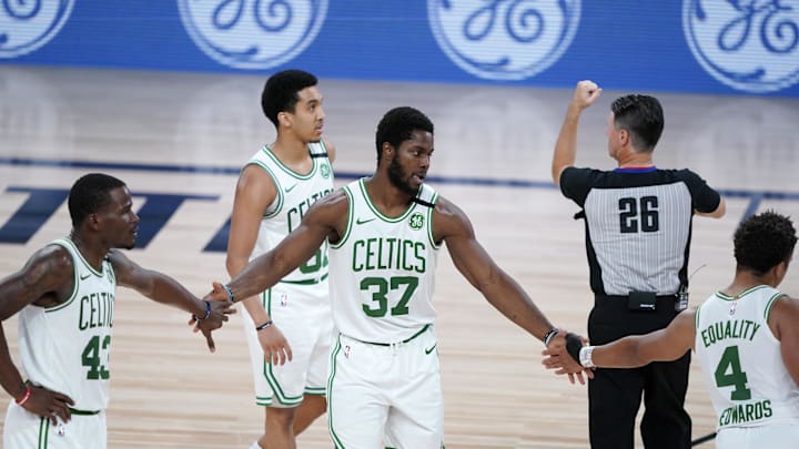 Aug 13, 2020; Lake Buena Vista, Florida, USA; Boston Celtics' Semi Ojeleye (37) is congratulated by teammates Javonte Green and Carsen Edwards (4) during the second half of an NBA basketball game against the Washington Wizards Thursday, Aug. 13, 2020 in Lake Buena Vista, Fla. at ESPN Wide World of Sports Complex. Mandatory Credit: Ashley Landis/Pool Photo-Imagn Images Aug 13, 2020; Lake Buena Vista, Florida, USA; Boston Celtics' Semi Ojeleye (37) is congratulated by teammates Javonte Green and Carsen Edwards (4) during the second half of an NBA basketball game against the Washington Wizards Thursday, Aug. 13, 2020 in Lake Buena Vista, Fla. at ESPN Wide World of Sports Complex. Mandatory Credit: Ashley Landis/Pool Photo-Imagn Images