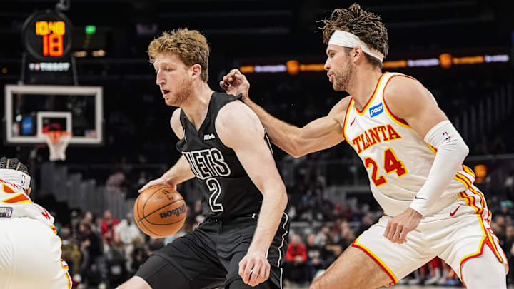 Mar 12, 2026; Atlanta, Georgia, USA; Brooklyn Nets forward Danny Wolf (2) dribbles defended by Atlanta Hawks forward Corey Kispert (24) during the first half at State Farm Arena. Mandatory Credit: Dale Zanine-Imagn Images