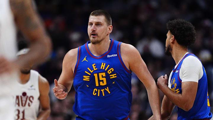 Feb 9, 2026; Denver, Colorado, USA; Denver Nuggets center Nikola Jokic (15) reacts in the first quarter against the Cleveland Cavaliers at Ball Arena.
