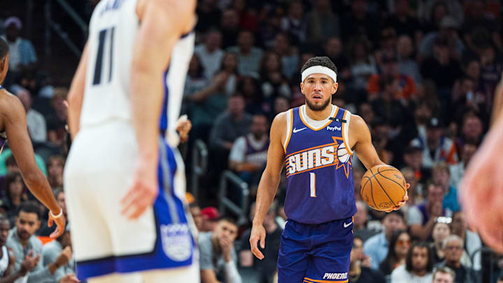 Nov 10, 2024; Phoenix, Arizona, USA; Phoenix Suns guard Devin Booker (1) works the ball down the court in the first half during a game against the Sacramento Kings at Footprint Center. Mandatory Credit: Allan Henry-Imagn Images