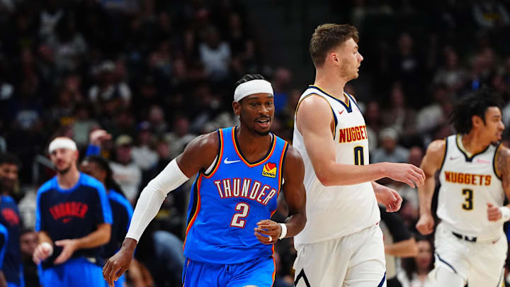 Oct 15, 2024; Denver, Colorado, USA; Oklahoma City Thunder guard Shai Gilgeous-Alexander (2) and Denver Nuggets guard Christian Braun (0) during the first quarter at Ball Arena. Mandatory Credit: Ron Chenoy-Imagn Images Oct 15, 2024; Denver, Colorado, USA; Oklahoma City Thunder guard Shai Gilgeous-Alexander (2) and Denver Nuggets guard Christian Braun (0) during the first quarter at Ball Arena. Mandatory Credit: Ron Chenoy-Imagn Images