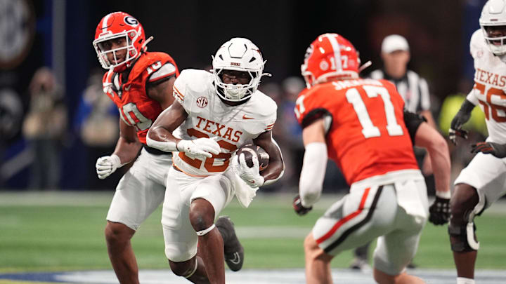 Texas Longhorns running back Quintrevion Wisner (26) rushes the ball against Georgia Bulldogs defensive back Dan Jackson (17) during the first half