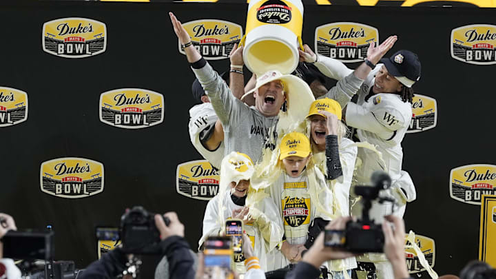 Jake Dickert reveled in the traditional mayonnaise dump after Wake Forest won the Duke's Mayo Bowl.