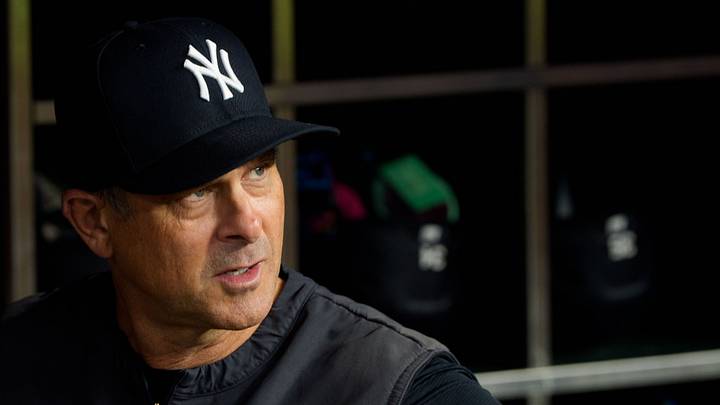 Sep 18, 2026; Phoenix, Arizona, USA;  New York Yankees manager Aaron Boone (17) looks on from the dugout before a game against the Arizona Diamondbacks at Chase Field.  Mandatory Credit: Allan Henry-Imagn Images