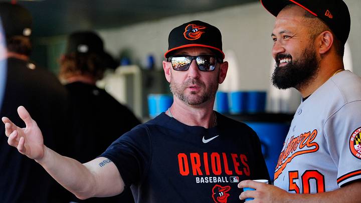 Sep 2, 2026: Baltimore Orioles manager Craig Albernaz (55) and Baltimore Orioles pitcher Rico Garcia (50) talk during the game against the Colorado Rockies  at Coors Field. Credit: Ron Chenoy-Imagn Images
