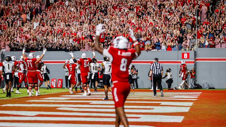 Sep 26, 2026; Raleigh, North Carolina, USA; NC State Wolfpack fans celebrate quarterback CJ Bailey (11) touchdown during the first half of the game against App State Mountaineers at Carter-Finley Stadium. Mandatory Credit: Jaylynn Nash-Imagn Images Sep 26, 2026; Raleigh, North Carolina, USA; NC State Wolfpack fans celebrate quarterback CJ Bailey (11) touchdown during the first half of the game against App State Mountaineers at Carter-Finley Stadium. Mandatory Credit: Jaylynn Nash-Imagn Images