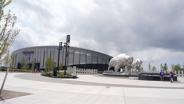 Early fans take in the history of Buffalo, the bison statues and the players wall of fame are in the family circle at Highmark Stadium. Early fans take in the history of Buffalo, the bison statues and the players wall of fame are in the family circle at Highmark Stadium.