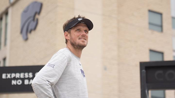 Kansas State coach Collin Klein waits for players to walk towards the indoor facility during practice at Kansas State University on Aug. 18, 2026. Kansas State coach Collin Klein waits for players to walk towards the indoor facility during practice at Kansas State University on Aug. 18, 2026.