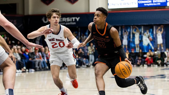 Feb 23, 2023; Moraga, California, USA;  Pacific Tigers guard Jordan Ivy-Curry (12) drives past St.