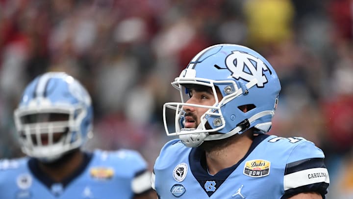 Dec 30, 2021; Charlotte, NC, USA; North Carolina Tar Heels quarterback Sam Howell (7) on the field  in the third quarter during the 2021 Duke's Mayo Bowl at Bank of America Stadium. Mandatory Credit: Bob Donnan-Imagn Images
