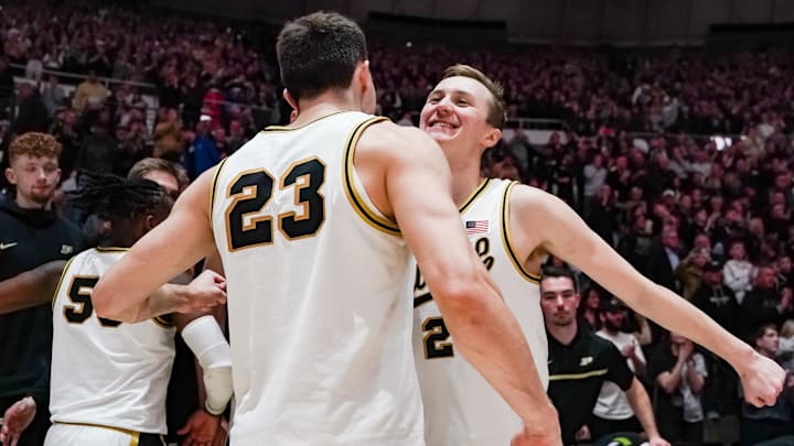Purdue Boilermakers forward Camden Heide (23) and guard Fletcher Loyer (2) celebrate 