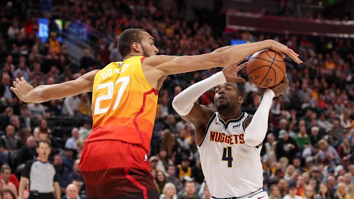 Apr 9, 2019; Salt Lake City, UT, USA; Utah Jazz center Rudy Gobert (27) blocks a shot by Denver Nuggets forward Paul Millsap (4) while shooting the ball during the first quarter at Vivint Smart Home Arena. Mandatory Credit: Chris Nicoll-Imagn Images