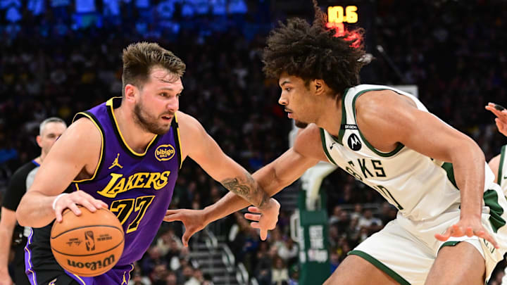 Mar 13, 2025; Milwaukee, Wisconsin, USA; Los Angeles Lakers guard Luka Doncic (77) drives to the basket against Milwaukee Bucks center Jericho Sims (00) in the fourth quarter at Fiserv Forum. Mandatory Credit: Benny Sieu-Imagn Images Mar 13, 2025; Milwaukee, Wisconsin, USA; Los Angeles Lakers guard Luka Doncic (77) drives to the basket against Milwaukee Bucks center Jericho Sims (00) in the fourth quarter at Fiserv Forum. Mandatory Credit: Benny Sieu-Imagn Images