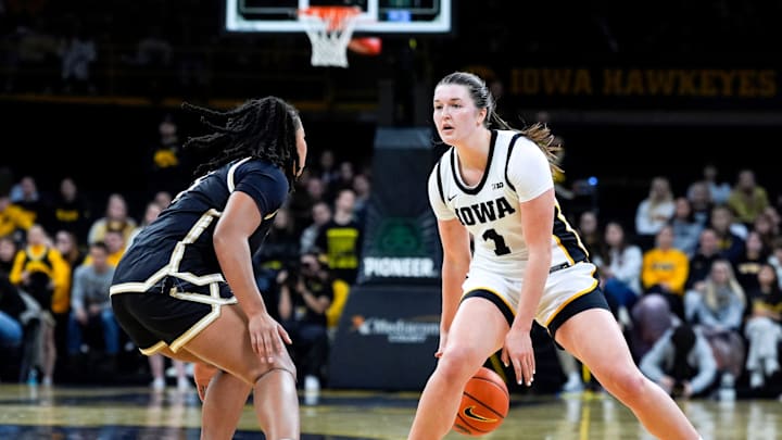 Iowa guard Taylor Stremlow (1) sets up the offense against the Lindenwood Lions Dec. 13, 2025 at Carver-Hawkeye Arena in Iowa City, Iowa. Iowa guard Taylor Stremlow (1) sets up the offense against the Lindenwood Lions Dec. 13, 2025 at Carver-Hawkeye Arena in Iowa City, Iowa.