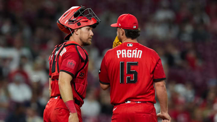 Apr 25, 2026; Cincinnati, Ohio, USA;  Cincinnati Reds catcher Tyler Stephenson (37) talks with pitcher Emilio Pagán (15) during a mound visit against the Detroit Tigers in the ninth inning at Great American Ball Park. Mandatory Credit: Aaron Doster-Imagn Images