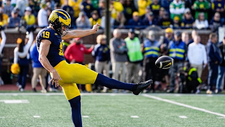 Michigan punter Tommy Doman (19) punts against Oregon during the first half at Michigan Stadium in Ann Arbor on Saturday, Nov. 2, 2024. Michigan punter Tommy Doman (19) punts against Oregon during the first half at Michigan Stadium in Ann Arbor on Saturday, Nov. 2, 2024.
