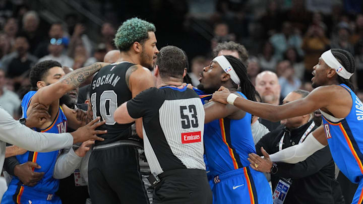Mar 2, 2025; San Antonio, Texas, USA;  San Antonio Spurs forward Jeremy Sochan (10) and Oklahoma City Thunder guard Luguentz Dort (5) in the middle of an altercation during the second half at Frost Bank Center. Mandatory Credit: Daniel Dunn-Imagn Images